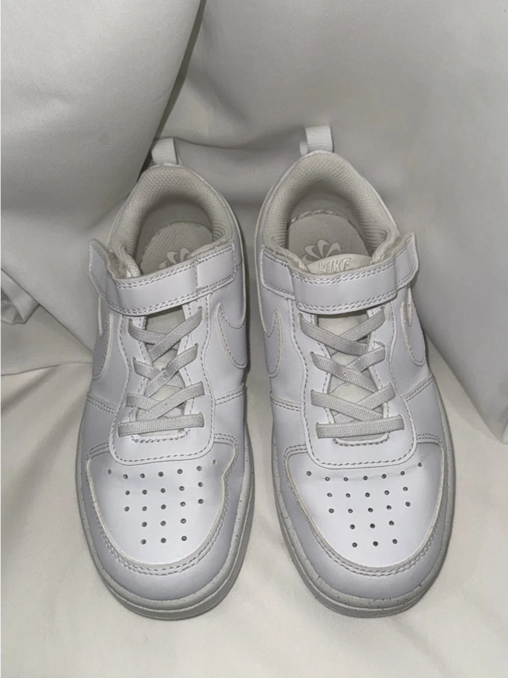 Boys white Nike sneakers